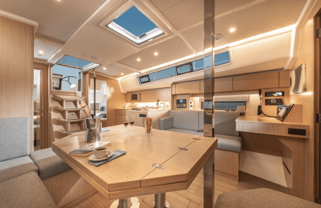 The bright interior of a yacht with a navigation area for chartwork